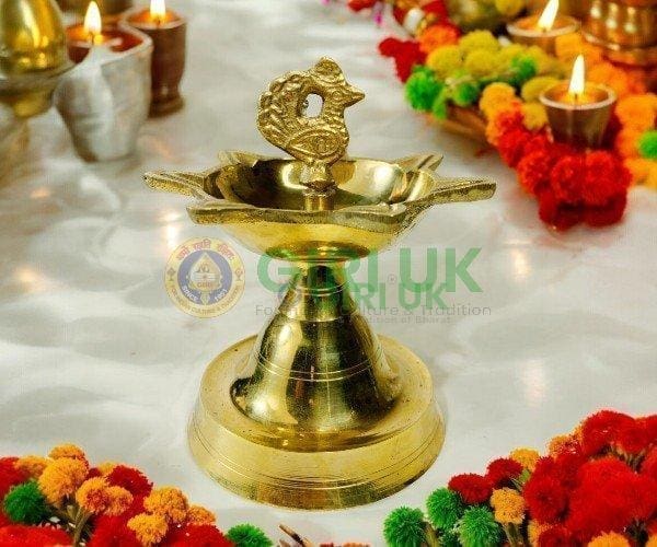 Seven-faced Vilakku with Annapakshi - brass